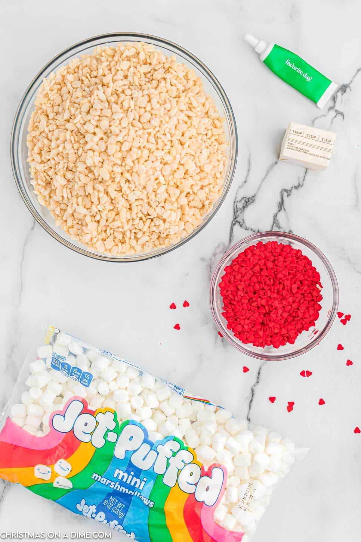 Ingredients needed - rice krispie cereal, marshmallows, butter, food coloring, red heart sprinkles
