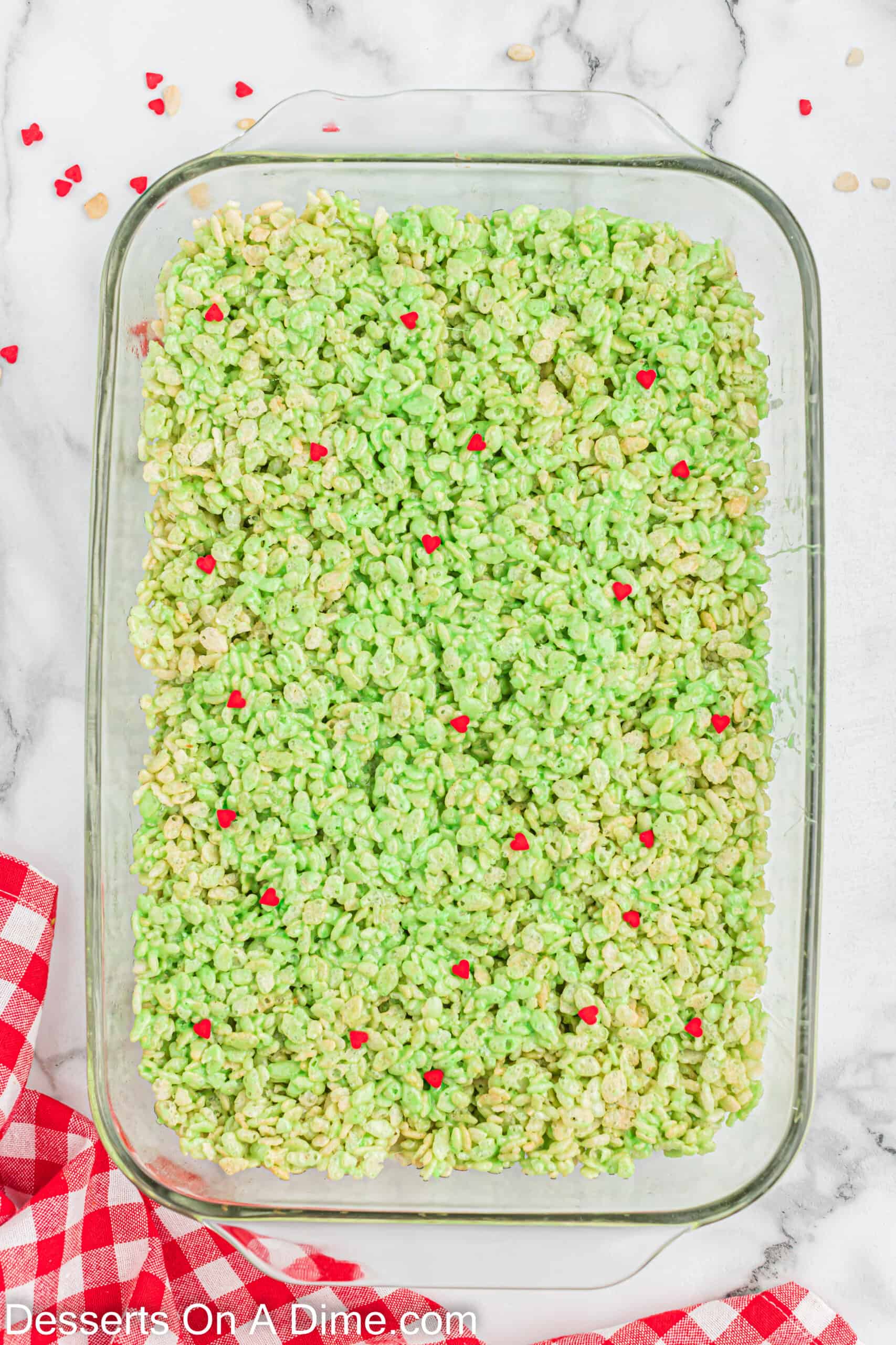 Pressing the marshmallow mixture in baking dish