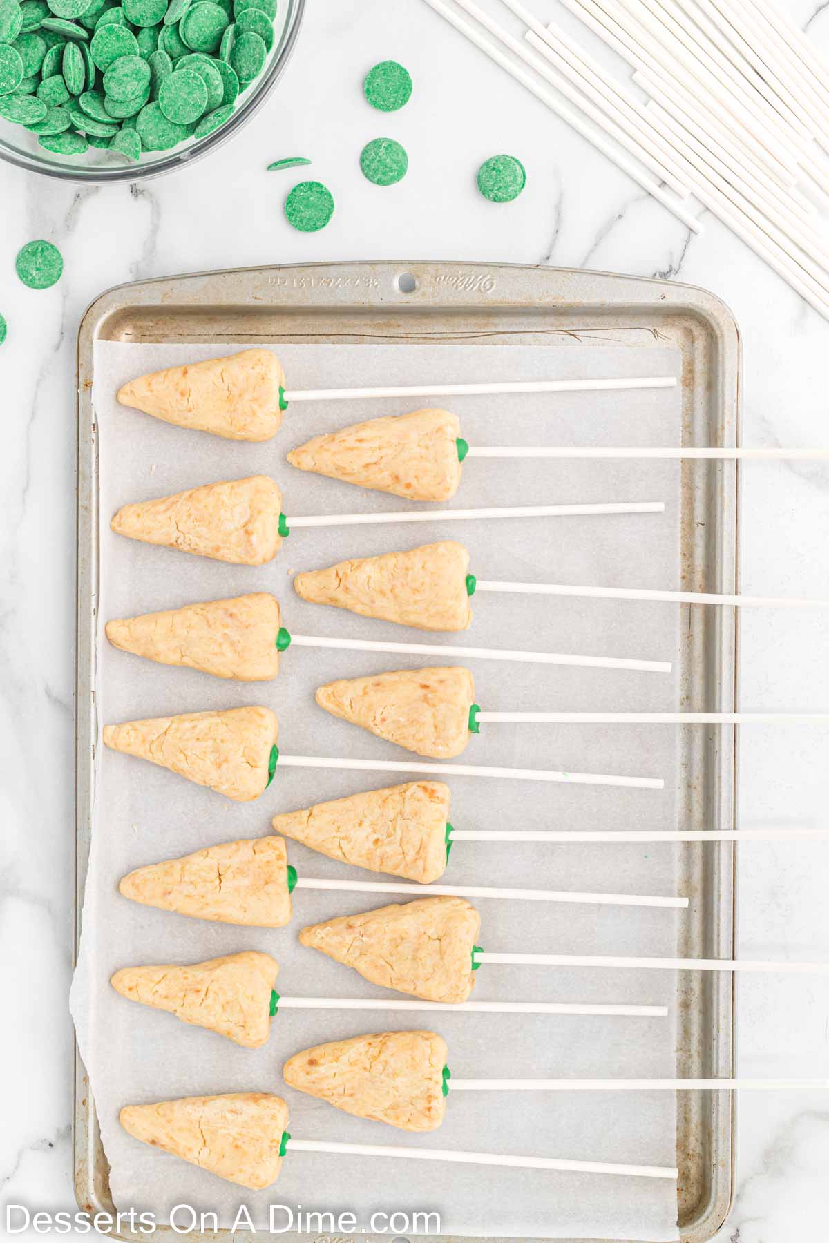 Lollipop stick stuck into the cone shaped cake mixture