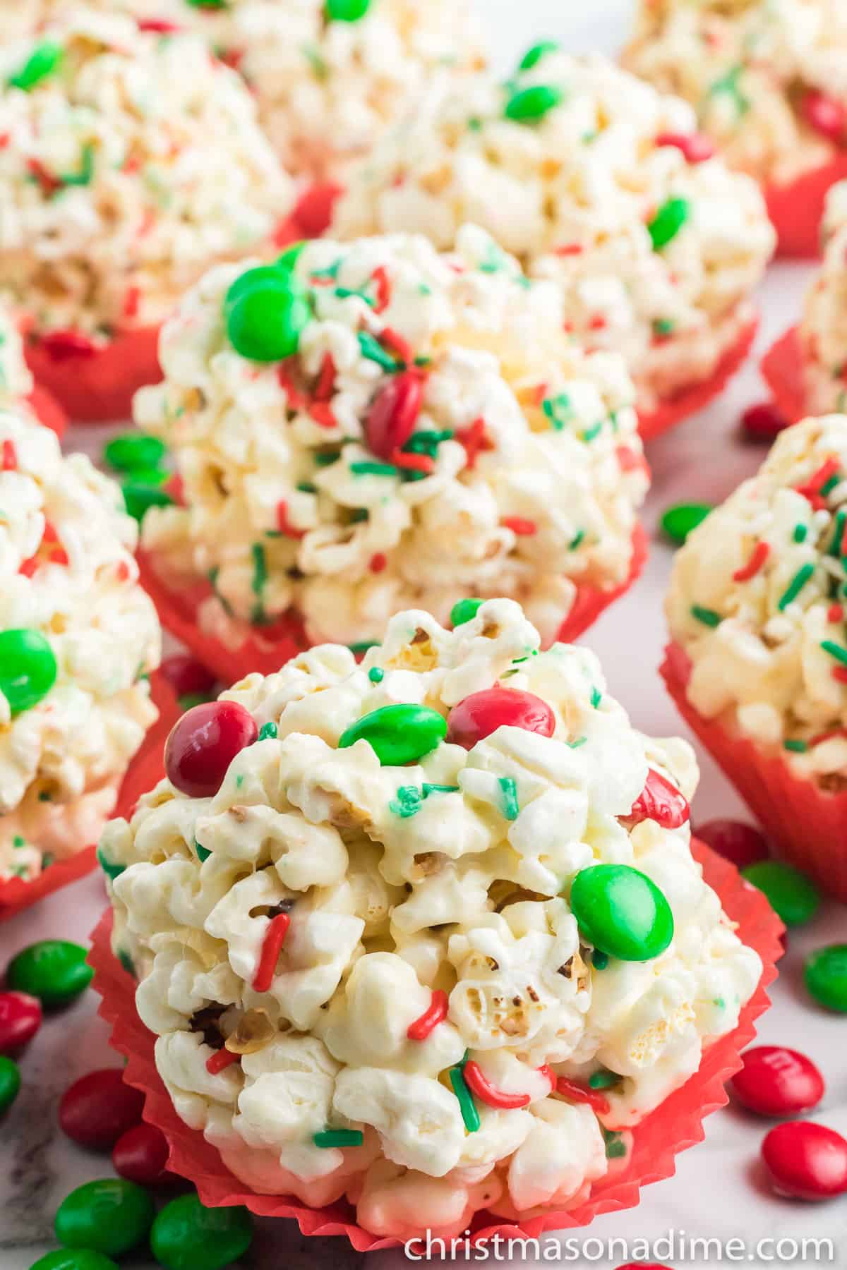 Christmas Popcorn Balls in a red cupcake liner