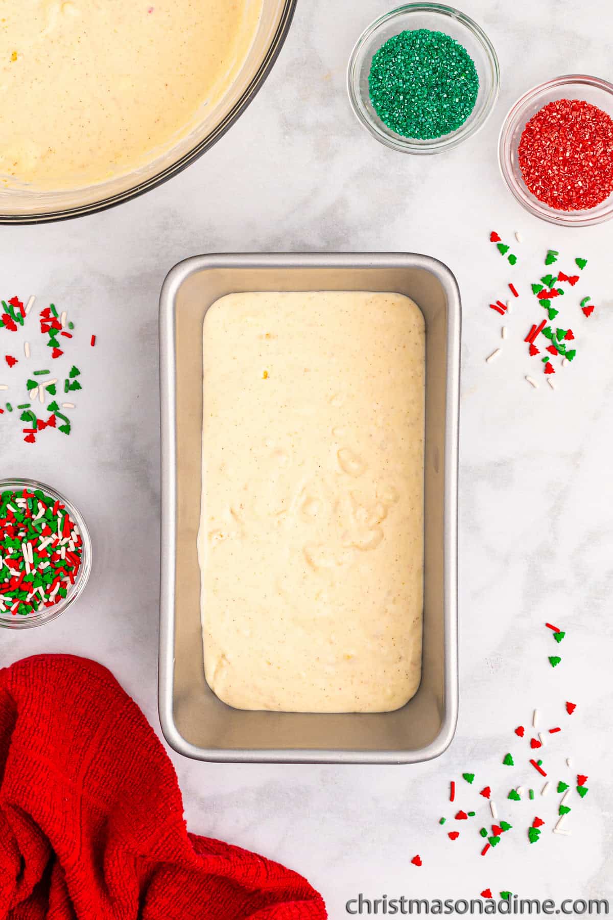 A layer of ice cream mixture in a loaf pan