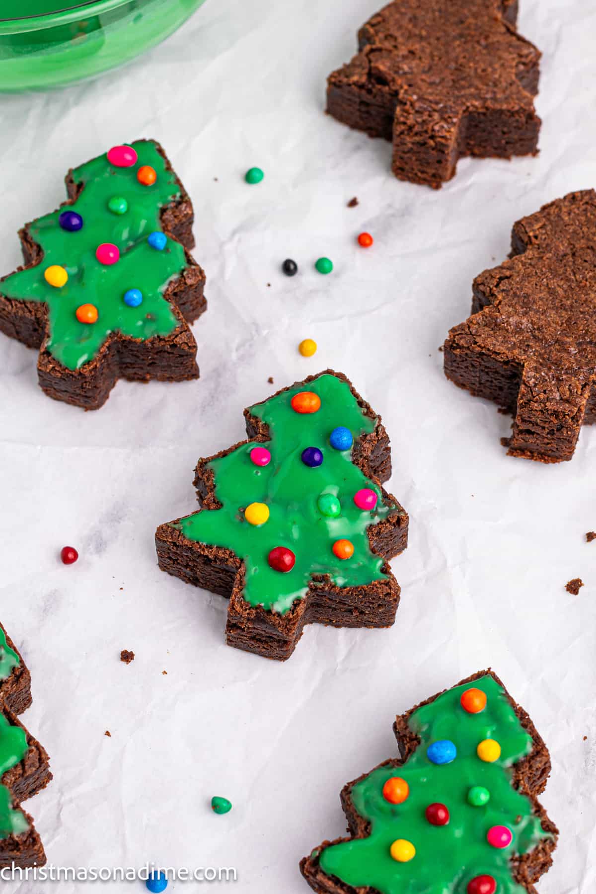 Brownies cut into Christmas Tree topped with green icing and colored M&Ms
